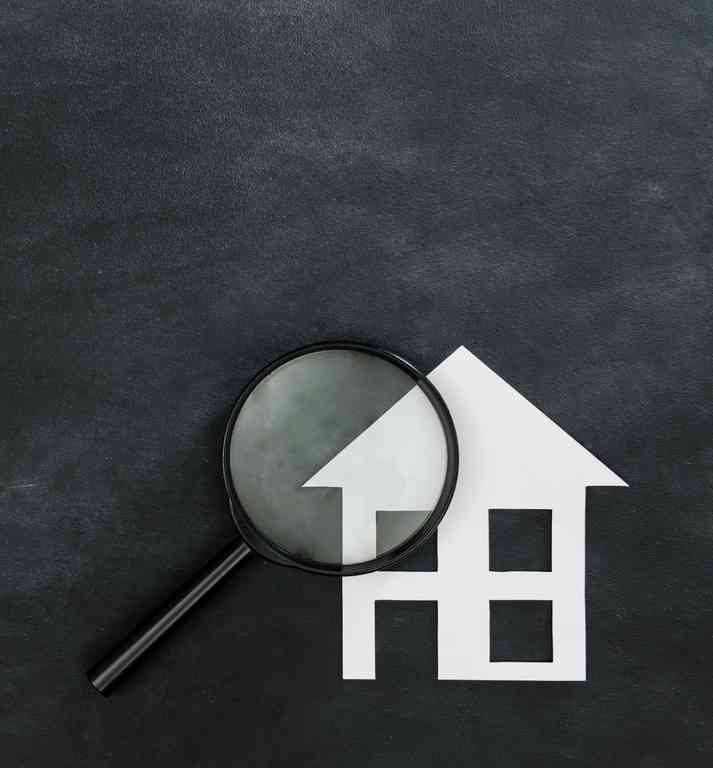 Illustrative image showing a drawing of a house and magnifying glass